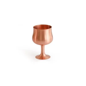 Handcrafted copper mug with 16-ounce capacity Copper mug with smooth, seamless surface and gleaming finish Copper mug filled with chilled cocktail Copper mug filled with iced coffee Copper mug with steaming hot chocolate