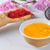 Ingredients and steps for making saffron tea, including saffron threads, hot water, and optional sweeteners