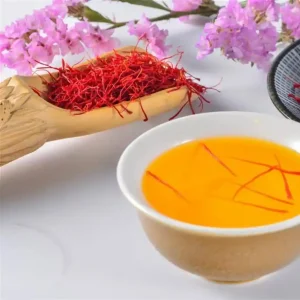 Ingredients and steps for making saffron tea, including saffron threads, hot water, and optional sweeteners